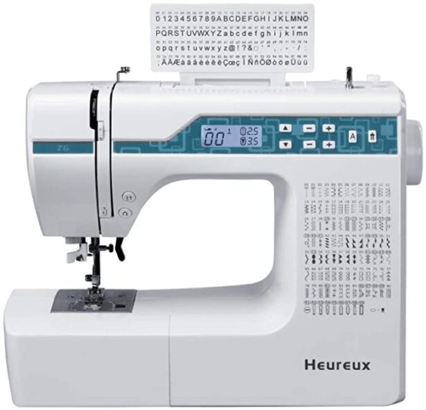 Heureux Z6, a computerized sewing and quilting machine with a blue control panel, a large sewing area, and a built-in thread cutter, ideal for making bags.
