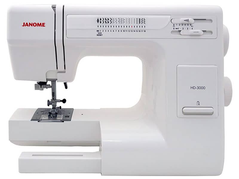 A white Janome HD3000 Sewing Machine with a variety of stitch options and a large sewing area, perfect for upholstery projects.