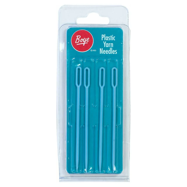 A set of four turquoise plastic yarn needles in a clear package with a red label

