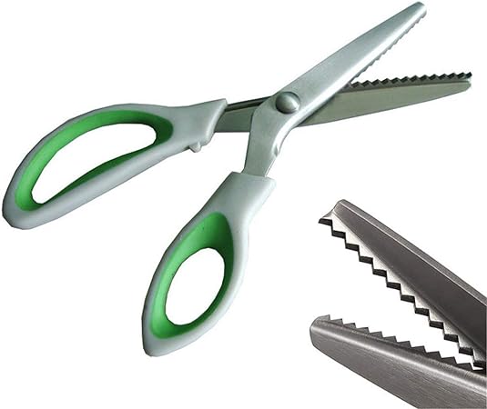  A pair of JISTL pinking shears with zigzag blades and green and grey handles on a white background with a close-up view of the cutting edge