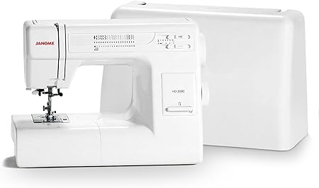 “A close-up photo of a Janome HD3000 heavy-duty sewing machine with a white body and a built-in needle threader, featuring 18 built-in stitches and a hard cover, perfect for Valentine’s Day sewing projects with thick and tough fabrics.”